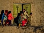Afghan children play near a house in Kandahar province in December.(AFP)