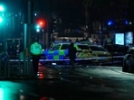 Police attend the scene near Kensington High Street in London.(AP) Police attend the scene near Kensington High Street in London.(AP)