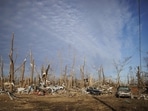 Cars lay scattered in a neighborhood almost completely decimated after a tornado ripped through the area the previous evening on December 11, 2021 in Mayfield, Kentucky. Cars lay scattered in a neighborhood almost completely decimated after a tornado ripped through the area the previous evening on December 11, 2021 in Mayfield, Kentucky.