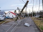 A downed power line is seen after a devastating outbreak of tornadoes ripped through several US states in Mayfield, Kentucky, US.