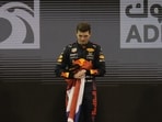 Red Bull driver Max Verstappen of the Netherlands stand on the podium after he became the world champion after winning the Formula One Abu Dhabi Grand Prix in Abu Dhabi, United Arab Emirates, Sunday, Dec. 12, 2021. (AP Photo/Hassan Ammar) Red Bull driver Max Verstappen of the Netherlands stand on the podium after he became the world champion after winning the Formula One Abu Dhabi Grand Prix in Abu Dhabi, United Arab Emirates, Sunday, Dec. 12, 2021. (AP Photo/Hassan Ammar)