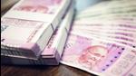 Indian Rupee money stacks and banknotes on the table , closed up shot (Shutterstock) Indian Rupee money stacks and banknotes on the table , closed up shot (Shutterstock)