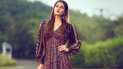 The midi dress is credited to the Indian fashion label, Verb by Pallavi Singhee, which boasts of an organic flavour with bohemian and romantic reminiscences, experimental use of textiles, vibrant print, delicate mixed with the bold, precious embroideries, colorful patterns and tribal details. The dress originally costs <span class='webrupee'>₹</span>13,800 on the designer website. (Instagram/officialraveenatandon) The midi dress is credited to the Indian fashion label, Verb by Pallavi Singhee, which boasts of an organic flavour with bohemian and romantic reminiscences, experimental use of textiles, vibrant print, delicate mixed with the bold, precious embroideries, colorful patterns and tribal details. The dress originally costs <span class='webrupee'>₹</span>13,800 on the designer website. (Instagram/officialraveenatandon)