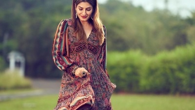 If there is one ensemble that is timeless and always in style, it has to be the midi dress and Bollywood actor Raveena Tandon was seen acing the same with elegance and grace. (Instagram/officialraveenatandon) If there is one ensemble that is timeless and always in style, it has to be the midi dress and Bollywood actor Raveena Tandon was seen acing the same with elegance and grace. (Instagram/officialraveenatandon)