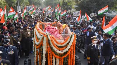 People participate in the funeral procession of late Chief of Defence Staff (CDS) Gen Bipin Rawat (PTI) People participate in the funeral procession of late Chief of Defence Staff (CDS) Gen Bipin Rawat (PTI)