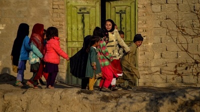 Afghan children play near a house in Kandahar province in December. (AFP)