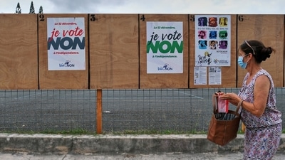 A woman walks past electoral posters calling to vote No to the referendum in Noumea, New Caledonia, Dec.12, 2021. (AP) A woman walks past electoral posters calling to vote No to the referendum in Noumea, New Caledonia, Dec.12, 2021. (AP)