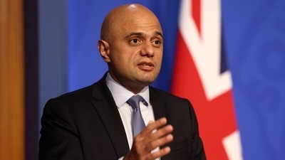 “We are taking this proportionate and more practical measure to limit the impact on people's day-to-day lives while helping to reduce the spread of Omicron,” Britain's health secretary Sajid Javid said. (Reuters)