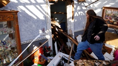 Debris from destroyed buildings and shredded trees covered the ground in Mayfield, a city of about 10,000 in western Kentucky. (REUTERS)