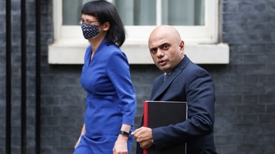 Britain's Health Secretary Sajid Javid walks at Downing Street in London. (Reuters)