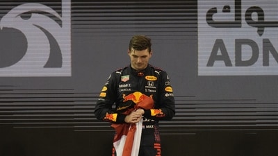 Red Bull driver Max Verstappen of the Netherlands stand on the podium after he became the world champion after winning the Formula One Abu Dhabi Grand Prix in Abu Dhabi, United Arab Emirates, Sunday, Dec. 12, 2021. (AP Photo/Hassan Ammar) Red Bull driver Max Verstappen of the Netherlands stand on the podium after he became the world champion after winning the Formula One Abu Dhabi Grand Prix in Abu Dhabi, United Arab Emirates, Sunday, Dec. 12, 2021. (AP Photo/Hassan Ammar)