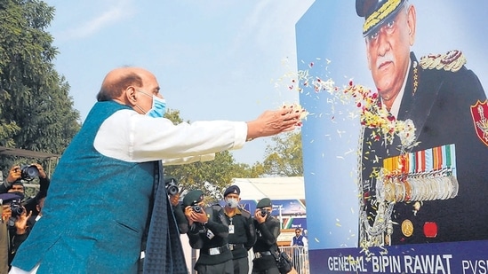 Defence minister Rajnath Singh pays floral tributes to the portrait of first CDS General Bipin Rawat, at the inauguration of ‘Swarnim Vijay Parv’, at India Gate, in New Delhi on Sunday. (ANI)