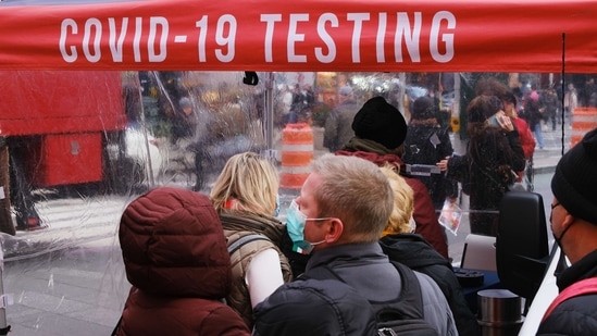 Omicron cases have been reported from as many as 63 countries as of December 9, the WHO said. In picture - People wait in line to get tested for Covid-19 at a testing facility in Times Square in New York City.(AFP | Representational image)
