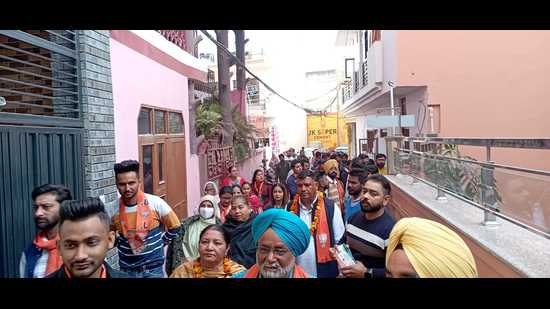 A BJP candidate campaigning for Chandigarh MC polls. (HT Photo) A BJP candidate campaigning for Chandigarh MC polls. (HT Photo)