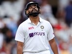 India's Rohit Sharma goes back to Pavillion after being dismissed during the second day of the test match between India and England, at Trent Bridge in Nottingham on Thursday