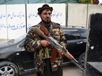 A Taliban fighter stand guards along a roadside in Jalalabad A Taliban fighter stand guards along a roadside in Jalalabad