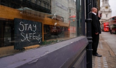 A sign reading 'stay safe' is placed at a shop window of a cafe in an empty street in the financial district, known as The City, in London (AP Photo) A sign reading 'stay safe' is placed at a shop window of a cafe in an empty street in the financial district, known as The City, in London (AP Photo)