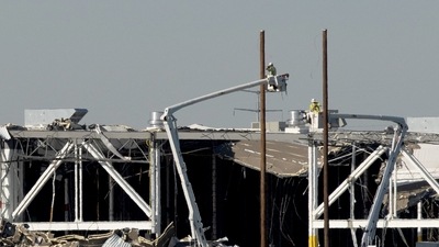 Amazon crew on lifts document the damage from the tornado that hit an Amazon distribution centre where the roof collapsed in Edwardsville, Illinois (REUTERS) Amazon crew on lifts document the damage from the tornado that hit an Amazon distribution centre where the roof collapsed in Edwardsville, Illinois (REUTERS)