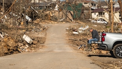 A resident amid destroyed homes following a tornado in Cambridge Shores, Kentucky, US. (Bloomberg) A resident amid destroyed homes following a tornado in Cambridge Shores, Kentucky, US. (Bloomberg)