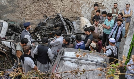 Afghan residents and family members of the victims gather next to a damaged vehicle inside a house, day after a US drone airstrike in Kabul.(AFP) Afghan residents and family members of the victims gather next to a damaged vehicle inside a house, day after a US drone airstrike in Kabul.(AFP)