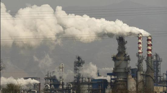 In this November 28, 2019 photo, smoke and steam rise from a coal processing plant in Hejin in central China’s Shanxi Province. India, China and Russia opposed and voted against the adoption of a draft resolution by the UN Security Council on climate change. (AP) In this November 28, 2019 photo, smoke and steam rise from a coal processing plant in Hejin in central China’s Shanxi Province. India, China and Russia opposed and voted against the adoption of a draft resolution by the UN Security Council on climate change. (AP)