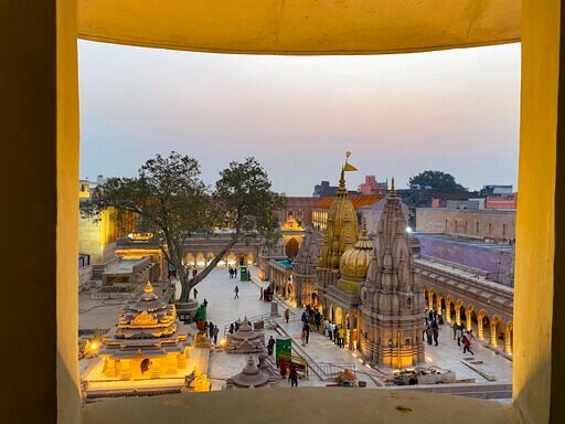 Devotees offering prayers at the Kashi Vishwanath temple are seen from a newly constructed part of the Kashi Vishwanath Dham Corridor in Varanasi, (AP File Photo) Devotees offering prayers at the Kashi Vishwanath temple are seen from a newly constructed part of the Kashi Vishwanath Dham Corridor in Varanasi, (AP File Photo)