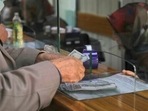 A man changes Turkish lira for US dollars at a currency exchange shop, in Ankara, Turkey, Monday, Dec. 13, 2021. (AP) A man changes Turkish lira for US dollars at a currency exchange shop, in Ankara, Turkey, Monday, Dec. 13, 2021. (AP)