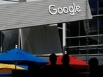 People walk by a Google sign on the company's campus in Mountain View, California(AP) People walk by a Google sign on the company's campus in Mountain View, California(AP)