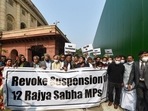 Congress MP Rahul Gandhi and other opposition parties’ members stage a protest demanding revocation of the suspension of 12 Rajya Sabha MPs, at Parliament premises in New Delhi, on Tuesday. (PTI) Congress MP Rahul Gandhi and other opposition parties’ members stage a protest demanding revocation of the suspension of 12 Rajya Sabha MPs, at Parliament premises in New Delhi, on Tuesday. (PTI)