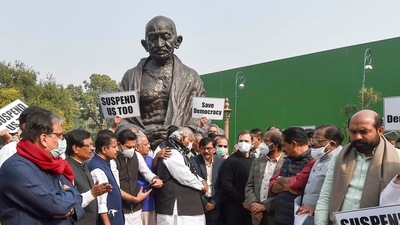Opposition parties' members with suspended Rajya Sabha MP's during a protest march from Parliament to Vijay Chowk, demanding revocation of the suspension of 12 Rajya Sabha MPs, at Parliament premises in New Delhi (PTI) Opposition parties' members with suspended Rajya Sabha MP's during a protest march from Parliament to Vijay Chowk, demanding revocation of the suspension of 12 Rajya Sabha MPs, at Parliament premises in New Delhi (PTI)