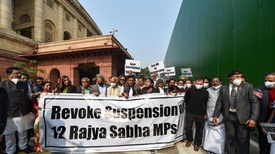 Congress MP Rahul Gandhi and other opposition parties’ members stage a protest demanding revocation of the suspension of 12 Rajya Sabha MPs, at Parliament premises in New Delhi, on Tuesday. (PTI) Congress MP Rahul Gandhi and other opposition parties’ members stage a protest demanding revocation of the suspension of 12 Rajya Sabha MPs, at Parliament premises in New Delhi, on Tuesday. (PTI)