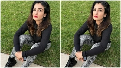 She accessorised her look with classic black boots and silver earrings. (Instagram/@officialraveenatandon)