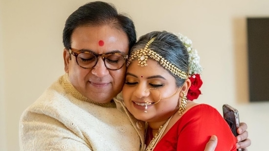 Dilip Joshi and his daughter Niyati share an emotional moment at her wedding.
