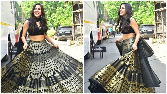 Sara Ali Khan swirls and flaunts her beautiful black and golden lehenga.(HT Photo/Varinder Chawla)