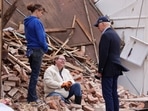 U.S. President Joe Biden speaks with a woman as he tours a neighborhood in Mayfield, Kentucky, US
