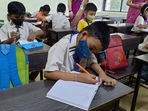 Schools for classes 1 to 4 have resumed from today. Visuals from Anand Vishwa Gurukul School in Thane as it begins online and offline classes for students.(Praful Gangurde/HT photo) Schools for classes 1 to 4 have resumed from today. Visuals from Anand Vishwa Gurukul School in Thane as it begins online and offline classes for students.(Praful Gangurde/HT photo)