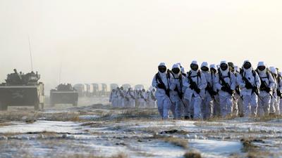 Soldiers and vehicles of China’s People's Liberation Army (PLA) Marine Corps march during a drill in Taonan, Jilin province. (REUTERS/FILE)