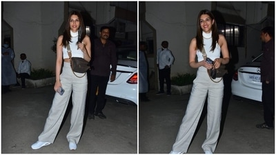 Kriti Sanon teamed her look with white sneakers and accessorised her attire with a golden necklace and a brown and grey bag. (HT Photo/Varinder Chawla)