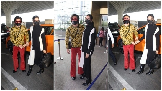 Ranveer Singh and Deepika Padukone have always managed to make heads turn whenever they step out. While the former loves experimenting with his clothing and opts for vibrant popping colours, the latter is always red carpet ready in her chic attire. Recently, the couple was spotted at the airport wearing fancy fits.(HT Photo/Varinder Chawla)