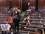 Opposition MPs sloganeering in the Well of Lok Sabha demanding the resignation of Minister of State (MoS) for Home Affairs Ajay Misra Teni over Lakhimpur Kheri incident during the Winter Session of Parliament, in New Delhi on Thursday.&nbsp;