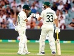 Australia's David Warner, left, and teammate Marnus Labuschagne bump fists between overs while batting against England during their Ashes cricket test match in Adelaide, Australia, Thursday, Dec. 16, 2021. (AP) Australia's David Warner, left, and teammate Marnus Labuschagne bump fists between overs while batting against England during their Ashes cricket test match in Adelaide, Australia, Thursday, Dec. 16, 2021. (AP)