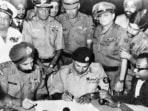Lt Gen AAK Niazi, the Cdr of Pakistani Eastern Command, signs the documented Instrument of Surrender in Dacca in the presence of Lt Gen Jagjit Singh Aurora (GOC-in-C of Indian Eastern Command(Indian Navy via Wikipedia Commons/HT Archive/Getty) Lt Gen AAK Niazi, the Cdr of Pakistani Eastern Command, signs the documented Instrument of Surrender in Dacca in the presence of Lt Gen Jagjit Singh Aurora (GOC-in-C of Indian Eastern Command(Indian Navy via Wikipedia Commons/HT Archive/Getty)