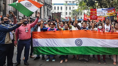 Bank employees hold the tricolour as they participate in a rally in support of &nbsp;a two-day nationwide strike called by the United Forum of Bank Unions to protest against the privatization of banks in Kolkata. (PTI)