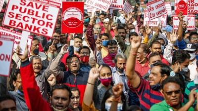 Bank employees shout slogans as part of the two-day nationwide strike called by the United Forum of Bank Unions (UFBU) against the government's plan to privatize the public sector banks in Ahmedabad. (PTI)