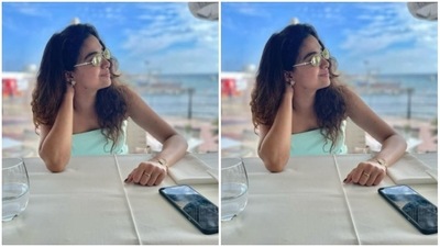 Through the tinted shades, Keerthy can be seen smiling at her view – the sea. (Instagram/@keerthysureshofficial)