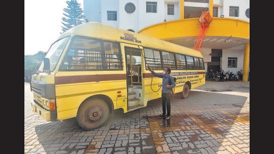 A school bus used for transporting school staff at Abhinav School in Ambegaon, is sanitised on Thursday. (Pratham Gokhale/HT Photo)