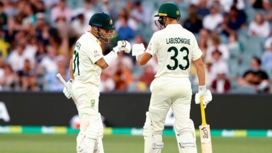 Australia's David Warner, left, and teammate Marnus Labuschagne bump fists between overs while batting against England during their Ashes cricket test match in Adelaide, Australia, Thursday, Dec. 16, 2021. (AP) Australia's David Warner, left, and teammate Marnus Labuschagne bump fists between overs while batting against England during their Ashes cricket test match in Adelaide, Australia, Thursday, Dec. 16, 2021. (AP)