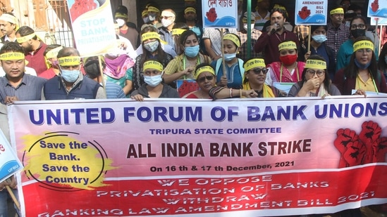 Agartala Bank employees shout slogans during a protest as part of a two-day nationwide strike called by the United Forum of Bank Unions (UFBU) against the government's plan to privatize the public sector banks in Agartala.(PTI)