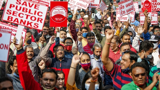 Bank employees shout slogans as part of the two-day nationwide strike called by the United Forum of Bank Unions (UFBU) against the government's plan to privatize the public sector banks in Ahmedabad.(PTI)