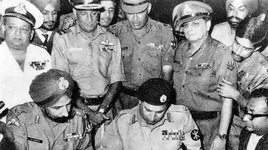 Lt Gen AAK Niazi, the Cdr of Pakistani Eastern Command, signs the documented Instrument of Surrender in Dacca in the presence of Lt Gen Jagjit Singh Aurora (GOC-in-C of Indian Eastern Command(Indian Navy via Wikipedia Commons/HT Archive/Getty)